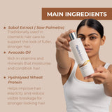 Woman holding a Neutriderm Hair Enhancer Conditioner with listed main ingredients on a beige background