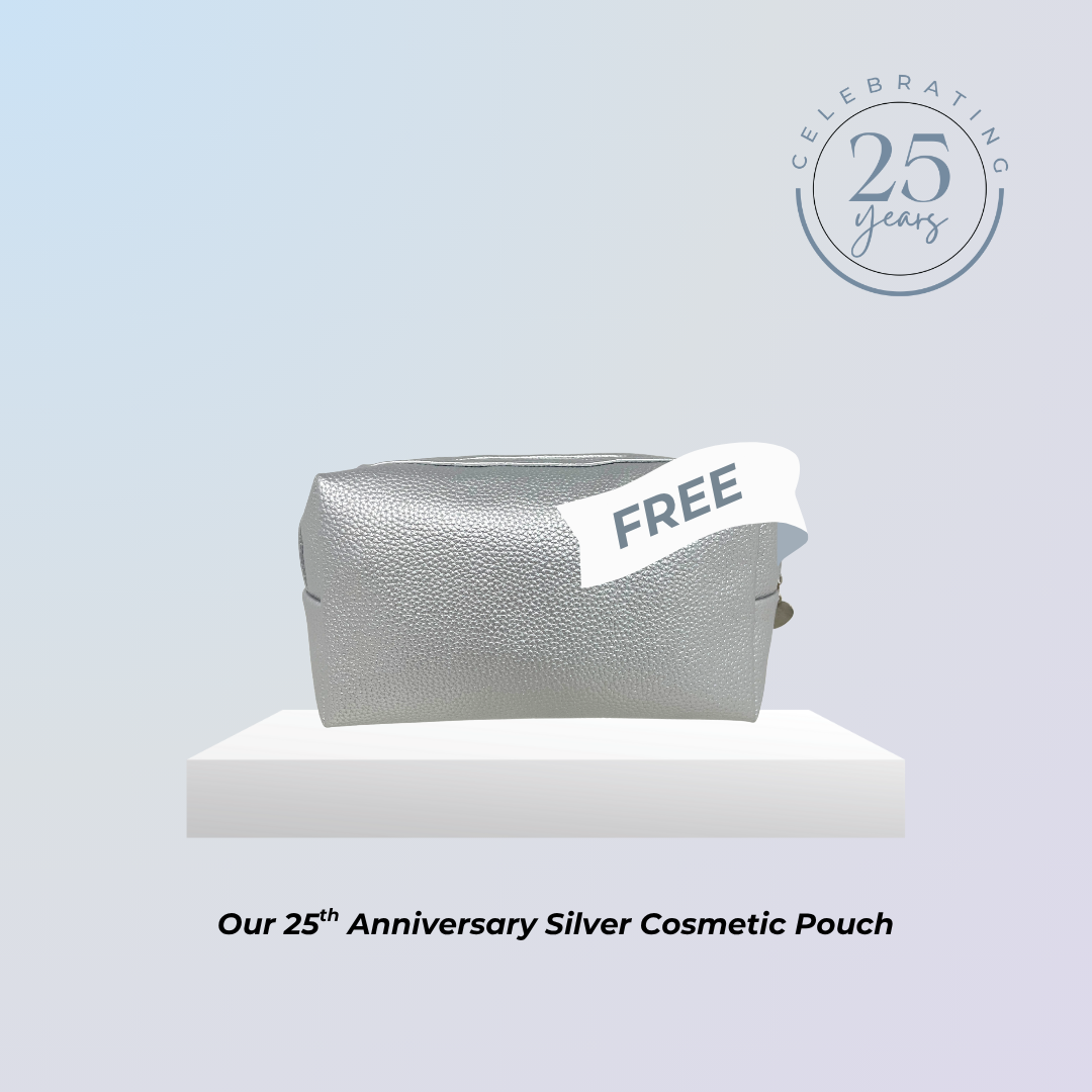 Silver cosmetic pouch with 'FREE' label on a light blue background, celebrating the 25th anniversary.