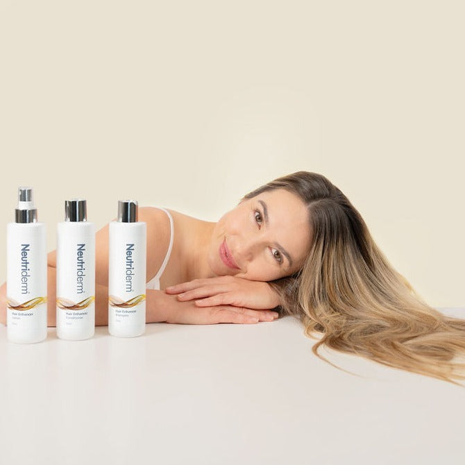 Model with Neutriderm shampoo, conditioner and lotion